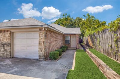 Single story home featuring a garage | Image 2