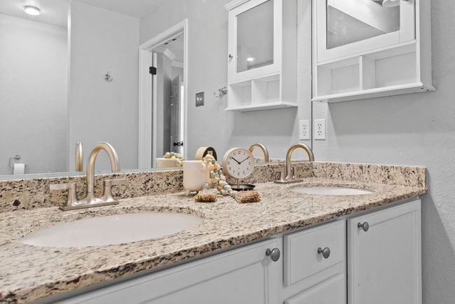 Primary ensuite Bathroom with granite double vanity | Image 15