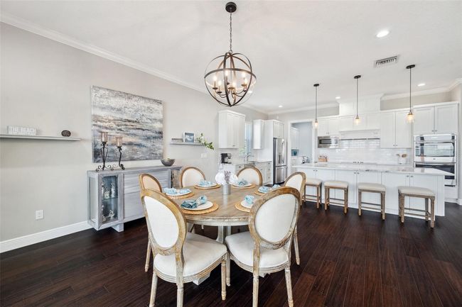 View of dining area and kitchen. | Image 36