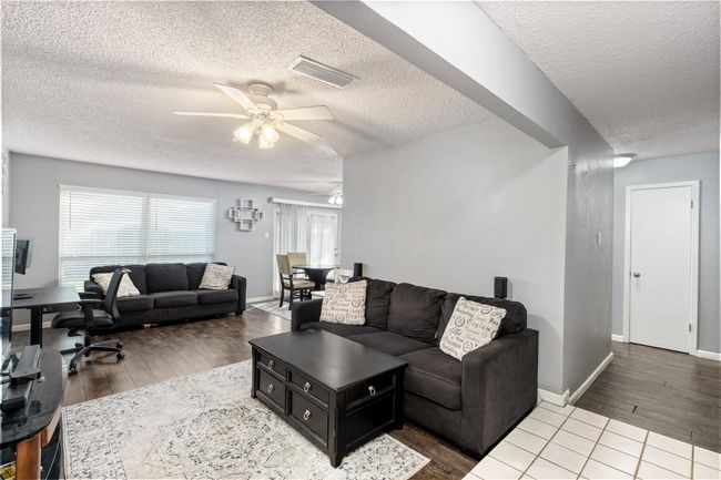 Living room featuring hardwood / wood-style floors and ceiling fan | Image 4