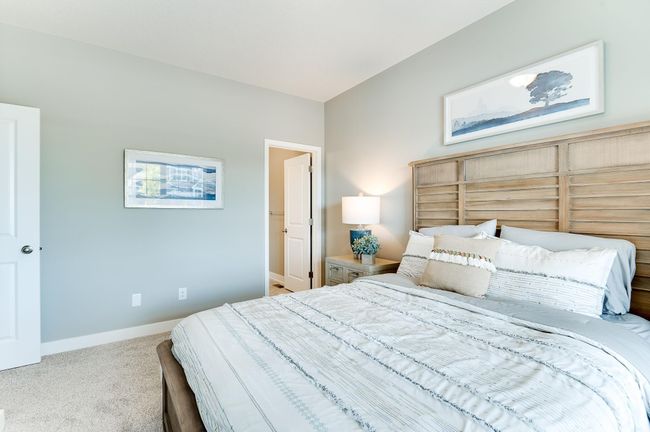 A guest room or perhaps the main level room with ensuite bath would be ideal for a home office. Photo of model home, color and options will vary. | Image 6