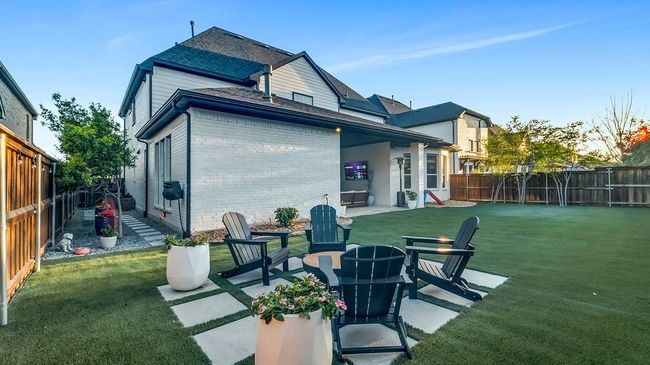 Back of house with a patio area and astroturf | Image 23