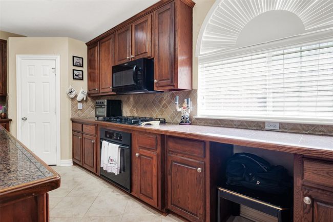 HUGE kitchen offers 'miles' of counter space and cabinets | Image 16
