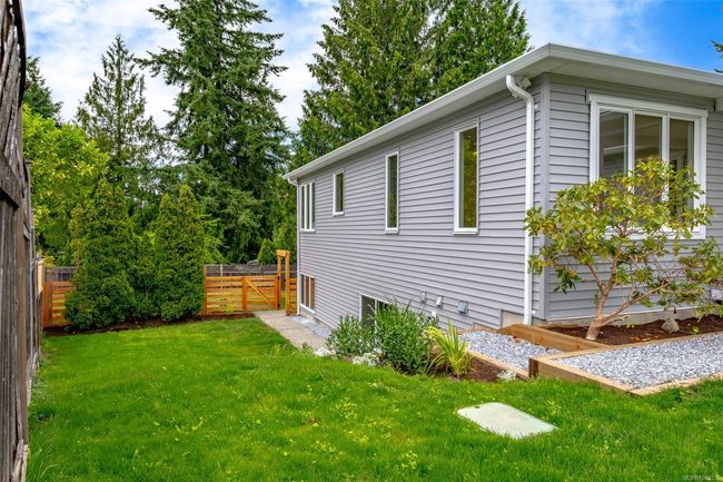 Side yard and walkway to downstairs entrance | Image 55