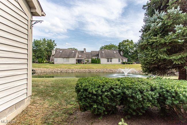View of green lawn with a water view | Image 5
