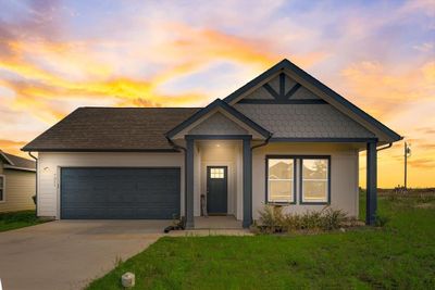 View of front of property with a garage and a yard | Image 3