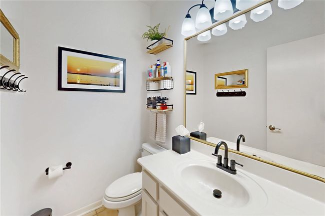 Bathroom featuring vanity and toilet | Image 24