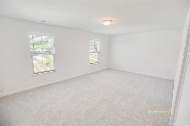Empty room featuring plenty of natural light, light carpet, and baseboards | Image 19