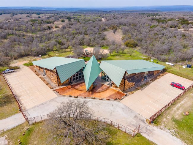 Aerial view of property and surrounding area featuring a forest | Image 22