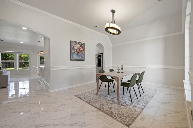 Formal Dining space crown molding, and a chandelier | Image 6