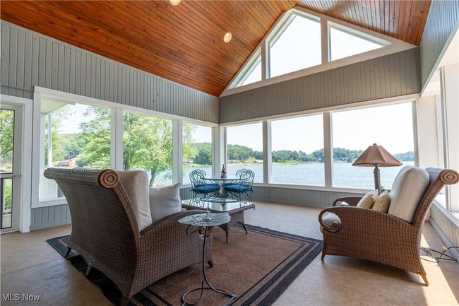 Enter through the screened porch. | Image 5