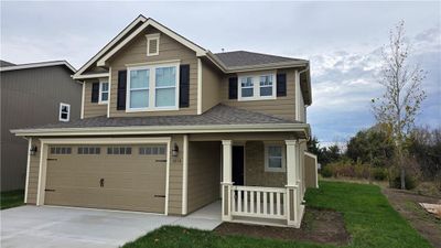 View of front of house with a garage | Image 1