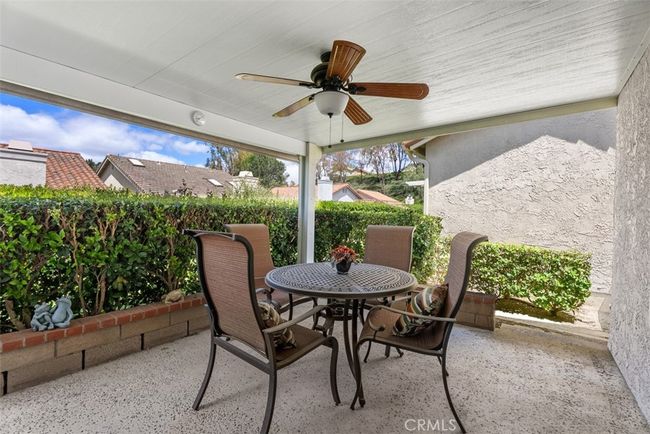 This is a view of the backyard patio area, great for a morning cup of coffee | Image 25