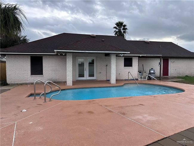 View of pool featuring a patio area and french doors | Image 15