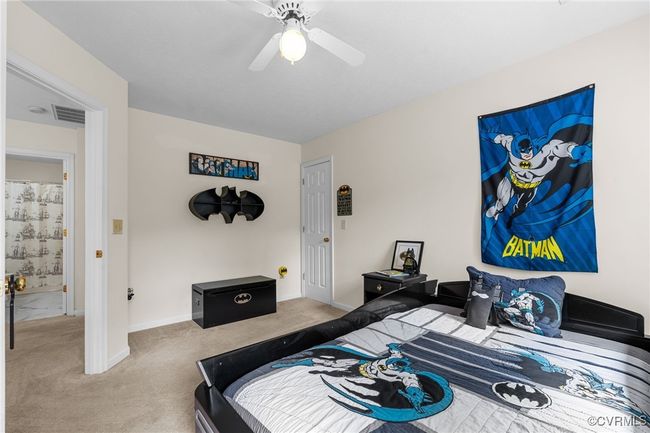 Bedroom with baseboards, carpet, and ceiling fan | Image 28