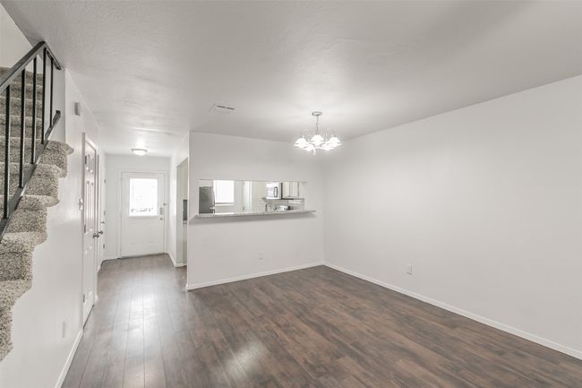 Living room & dining room with breakfast bar into kitchen. | Image 6