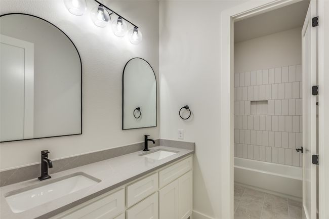Full bathroom featuring double vanity and a sink | Image 14