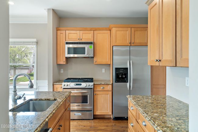 Kitchen area with center island | Image 15