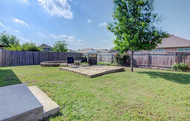 View of yard with a fenced backyard and a patio area | Image 20