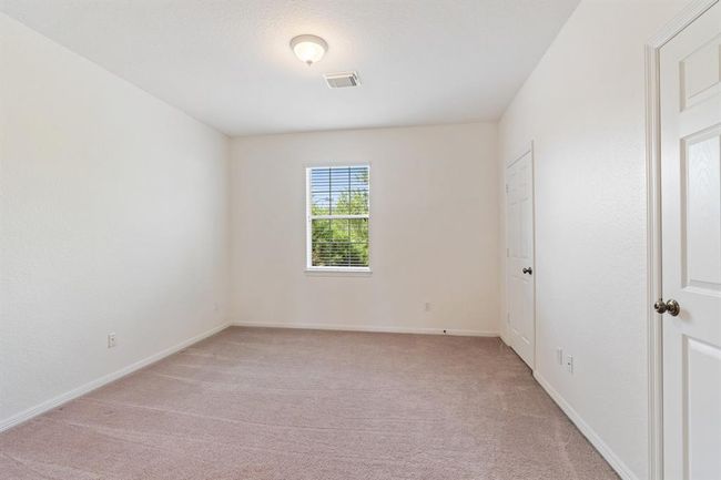 One of the four secondary bedrooms located on the second floor. | Image 24