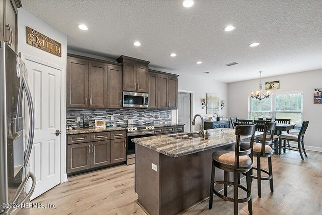 island breakfast bar with sink and dishwasher | Image 7