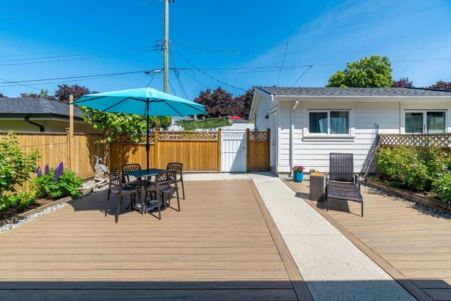 Wooden deck featuring outdoor dining area | Image 18