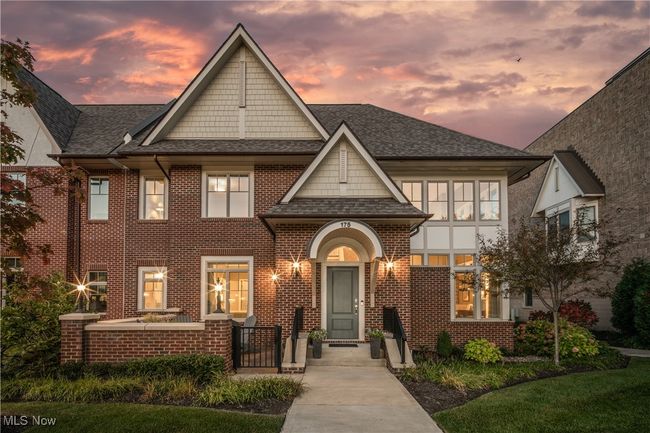 Beautiful twilight view showcasing the front of the townhome | Image 38