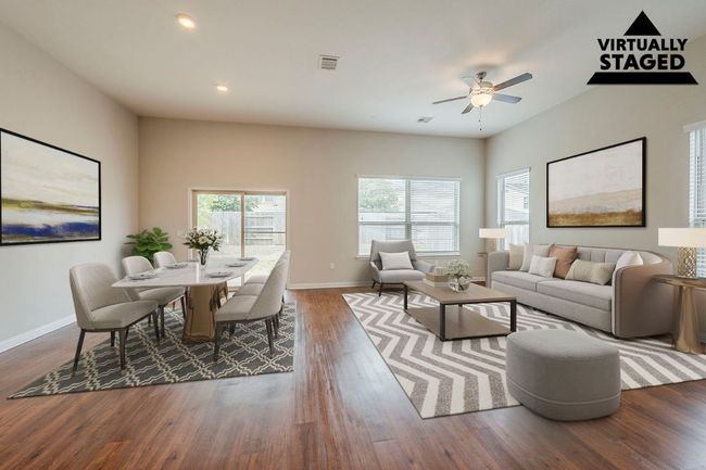Living area with ceiling fan, baseboards, dark wood-type flooring, and recessed lighting | Image 8