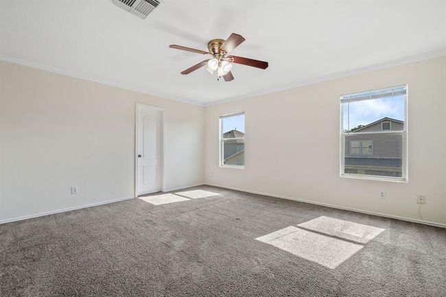 Primary bedroom with fresh carpet and generous space. | Image 15
