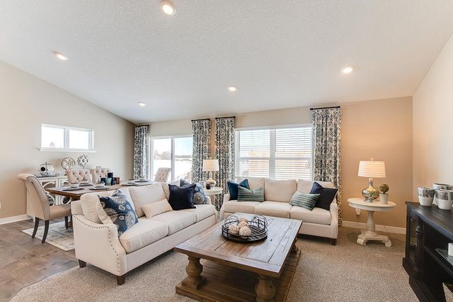 Main level living room area, enough space to accommodate many different furniture arrangements. Model home photo, colors and selections may vary. | Image 7