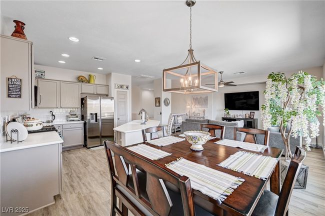 Dining space with ceiling fan, light wood-type flooring, and recessed lighting | Image 9