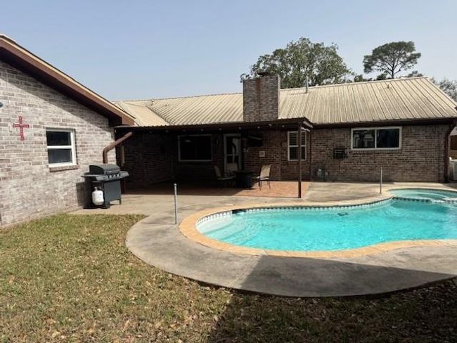 Plenty of grass/yard for pets and kids to run and play. Notice the window AC unit for the detached garage? Great place to work on cars, man cave option, home gym...so many possibilities | Image 24