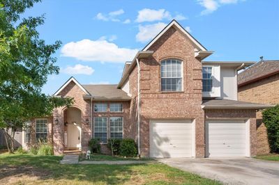 Front facade featuring a garage | Image 2