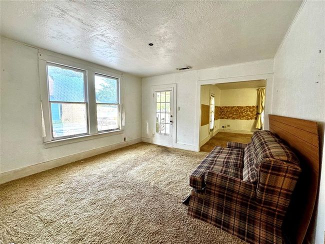 A second entry door into the dining room. Soft spots under the carpet. BE CAREFUL where you step. | Image 12