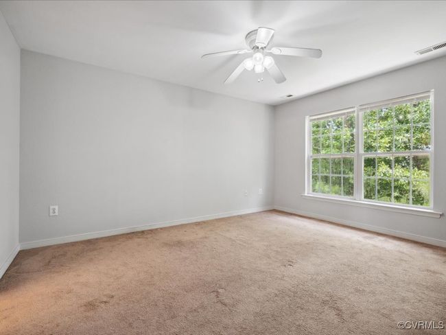 Unfurnished room featuring carpet and ceiling fan | Image 18