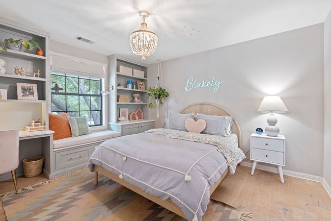Bedroom features custom built ins, desk and reading nook. | Image 27