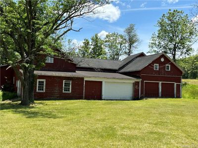 View of front of home with a garage and a front yard | Image 2