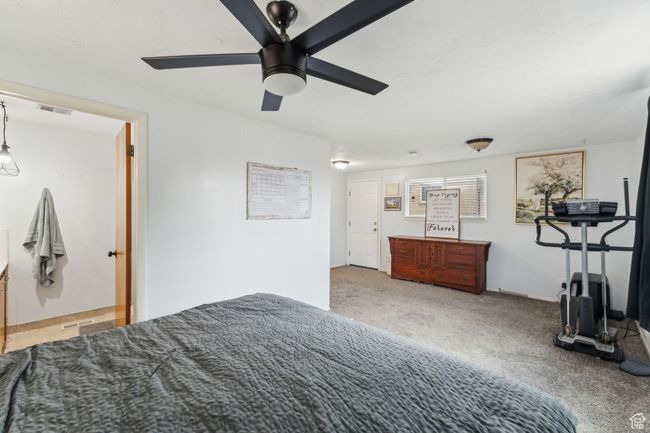 Carpeted bedroom featuring visible vents and a ceiling fan | Image 18