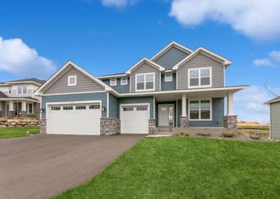 Photo is of the actual home. What a stunning display from the street! 526 Heartland Dr features 4 bedrooms and 2.5 baths. | Image 1