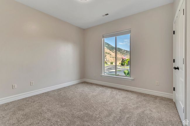 Spare room featuring carpet floors | Image 26
