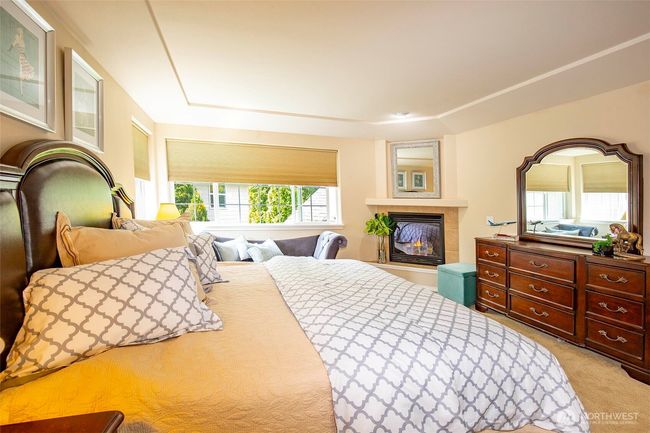Primary Bedroom with Corner Gas Fireplace. | Image 20