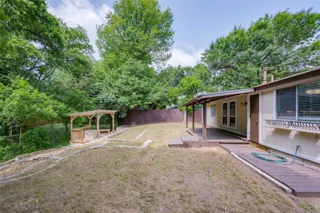 View of yard with a fenced backyard, a pergola, and a wooden deck | Image 30