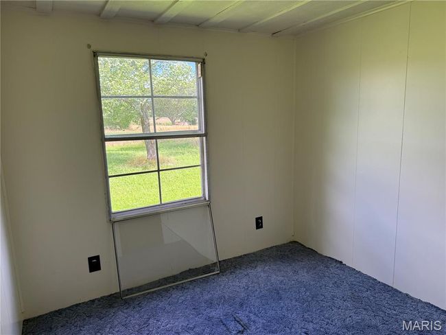 View of carpeted spare room | Image 17