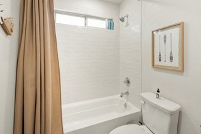 Bathroom with shower / tub combo and toilet | Image 17