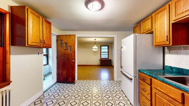 Kitchen looking out to dining room. | Image 8