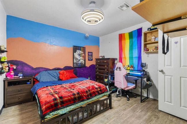 Bedroom featuring hardwood / wood-style floors | Image 12