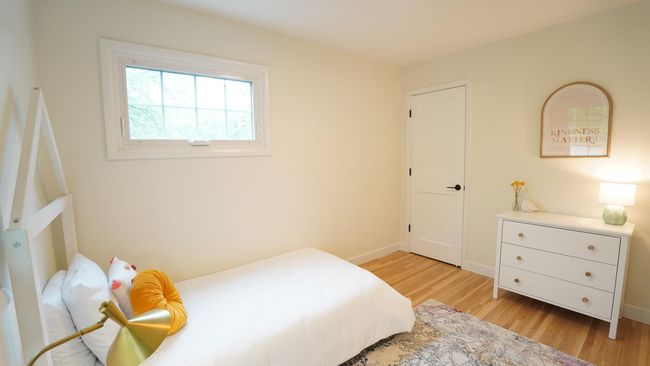 Staged as a precious childs' bedroom, the third bedroom could also make for an excellent office. The fresh paint, new doors and trim update the space beautifully. | Image 28