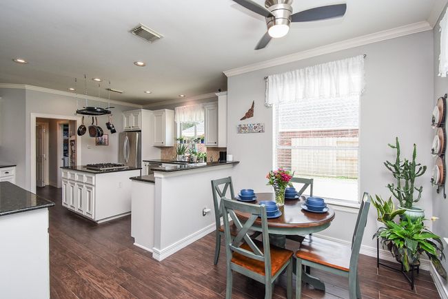 Your breakfast area is laced with a huge window that shines bright on your cozy morning meals! The space where you can enjoy your early morning cup of coffee before the children wake up. | Image 10