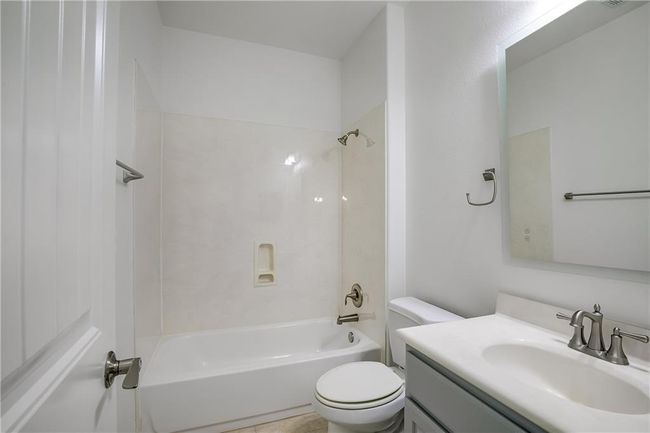 Bathroom with vanity and bathtub / shower combination | Image 7