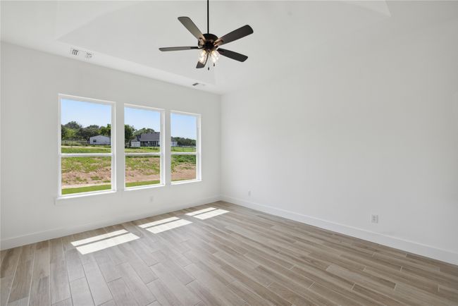Empty room with light hardwood / wood-style floors and ceiling fan | Image 22